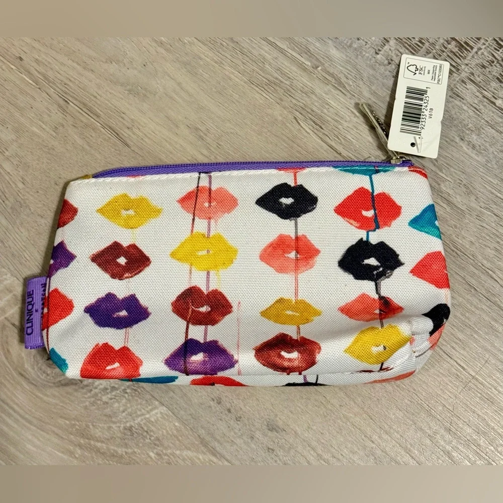 Clinique cosmetics bag is adorned with a vibrant print featuring colorful lips.